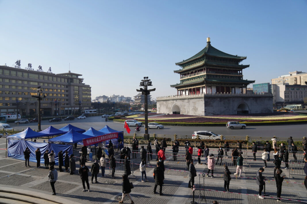 China orders lockdown of up to 13 million people in Xi'an amid virus spike