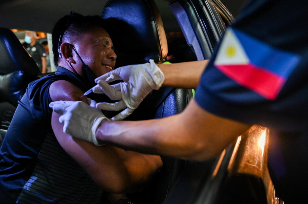 Philippines confirms community transmission of omicron, cases hit record