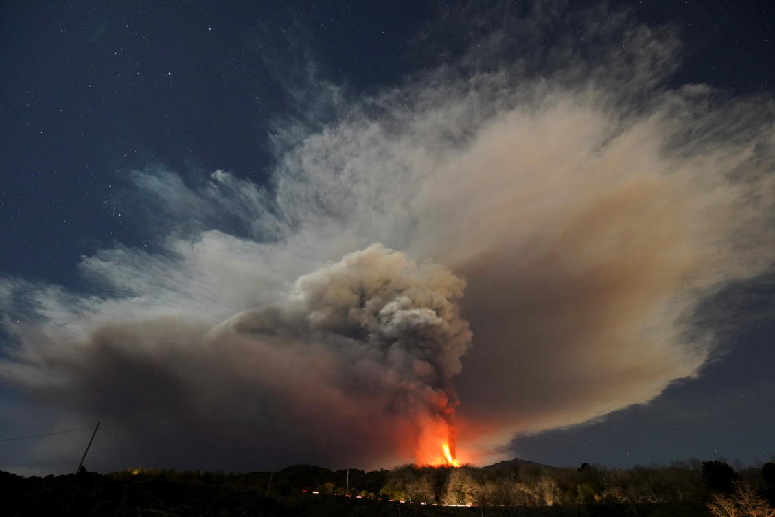 Volcanic lightning streaks sky over fiery Mount Etna